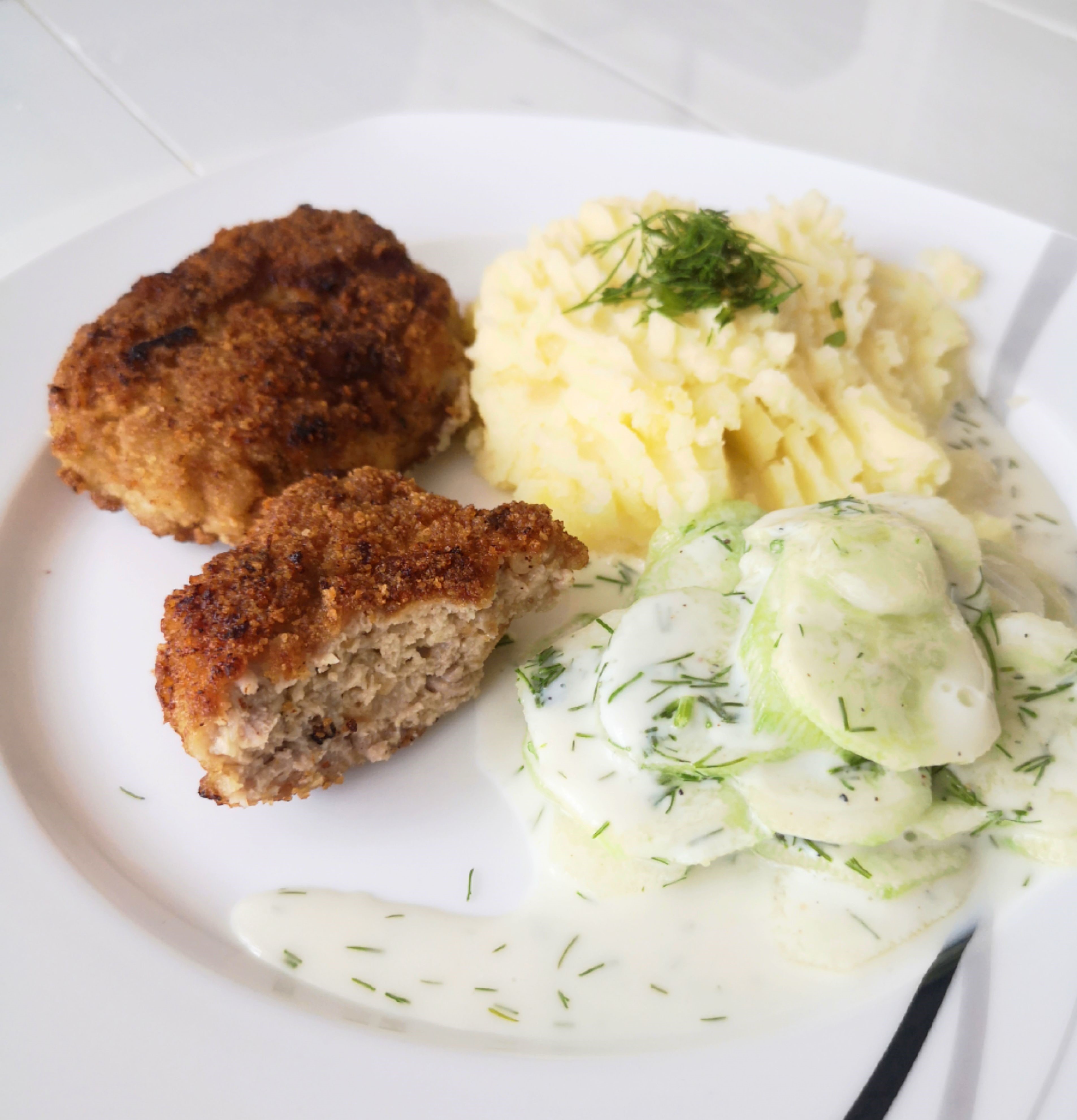 Meat patties, potatoes, and salad